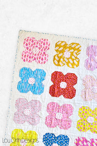 Flower friends is a FQ friendly repeat block modern quilt pattern