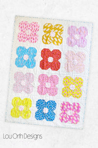 Flower Friends is a modern floral quilt pattern that is also fabric friendly.